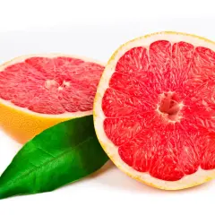 Två halvor av en saftig grapefrukt med en grönskande blad. Grapefrukt kan vara en del av en hälsosam kost för personer med diabetes.